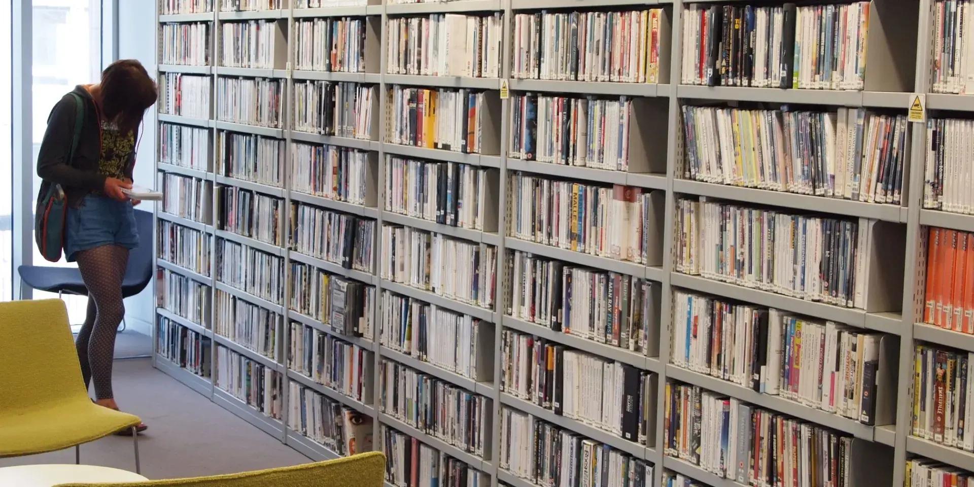 A library users browsing the ECA DVD collection