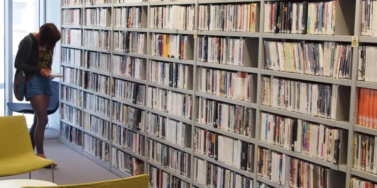 A library users browsing the ECA DVD collection