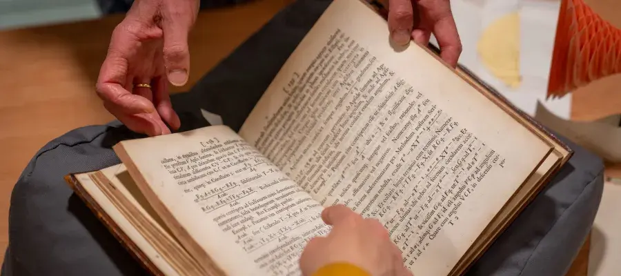 Close up of hands and a book