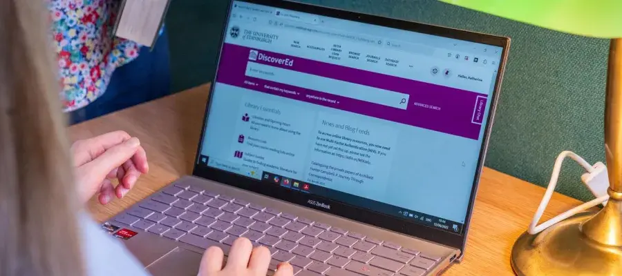 Student using a laptop to search DiscoverEd
