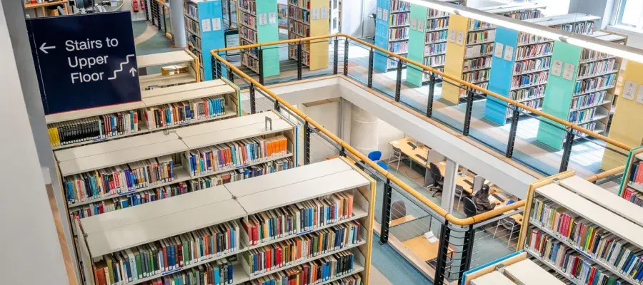Shelves of books in the Library, looking down from above