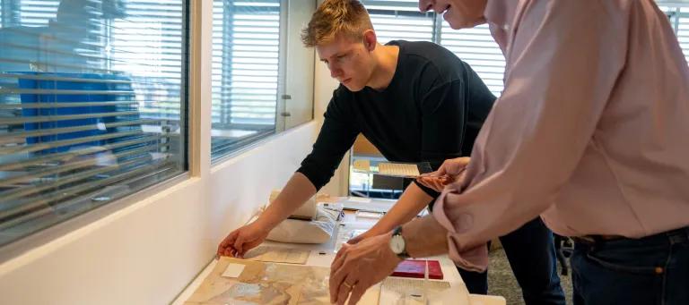 This image shows a student with a lecturer discussing collections.