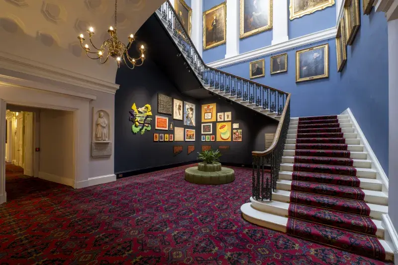 View of collection artworks in Old College stairwell