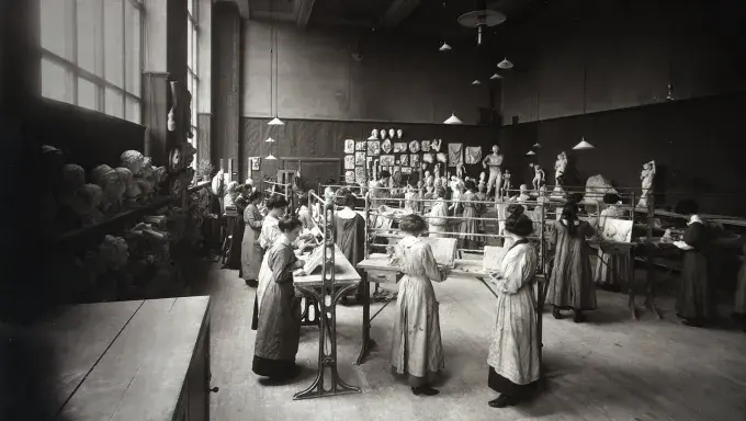 Group of students working on ornamental plasterwork in an Edinburgh College of Art studio containing casts c.1910s, Edinburgh College of Art Archive