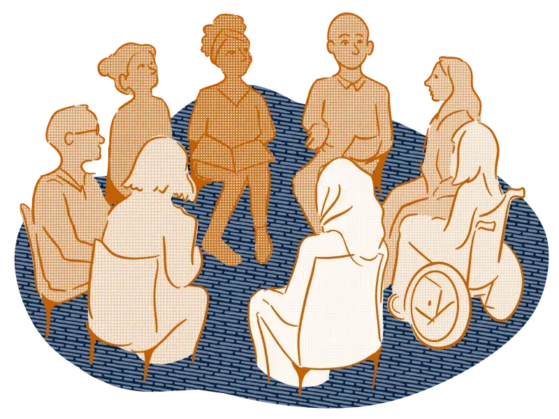 A group of people sit in a circle discussing research directions.