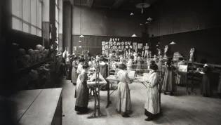 Group of students working on ornamental plasterwork in an Edinburgh College of Art studio containing casts c.1910s, Edinburgh College of Art Archive
